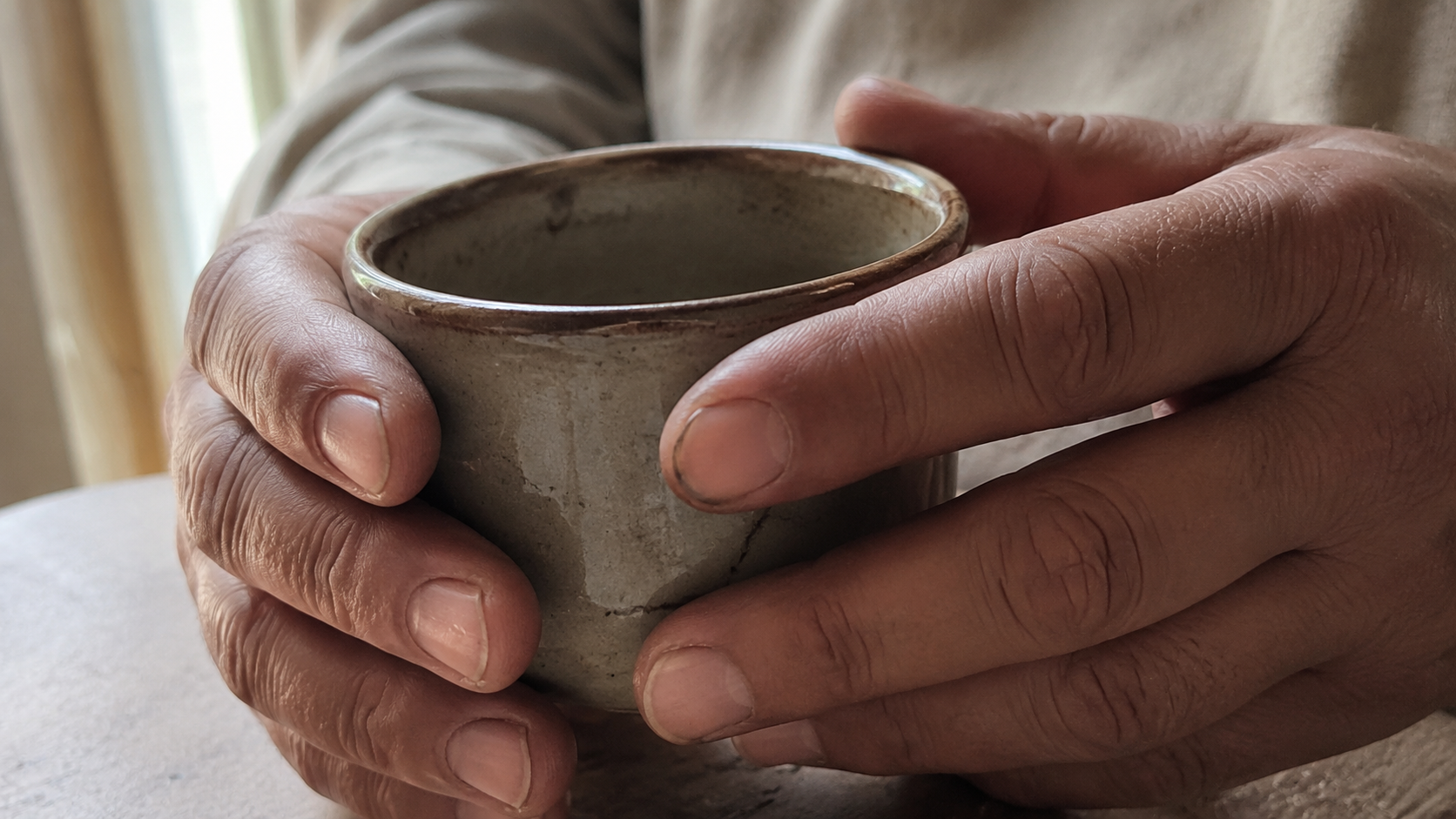 Photo-Realism Study: Aging Ceramic Cup and Human Hand Detail in Camera-Grade Image Creation